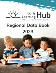 Photo of the cover of the 2023 Regional Data Book. Three young boys sitting together on a brown couch reading a large book together.